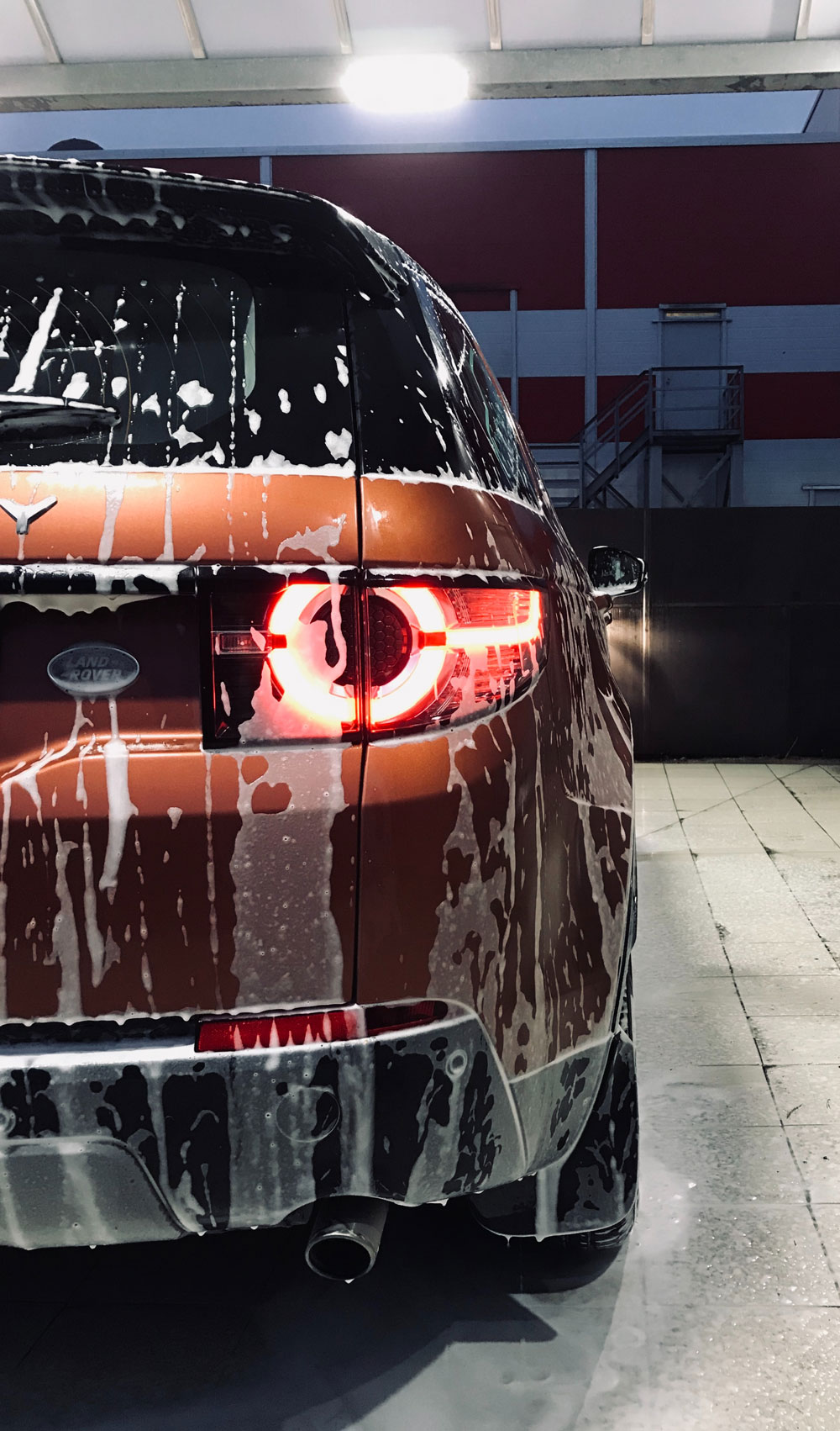 a car with soapy white foam on the back Home